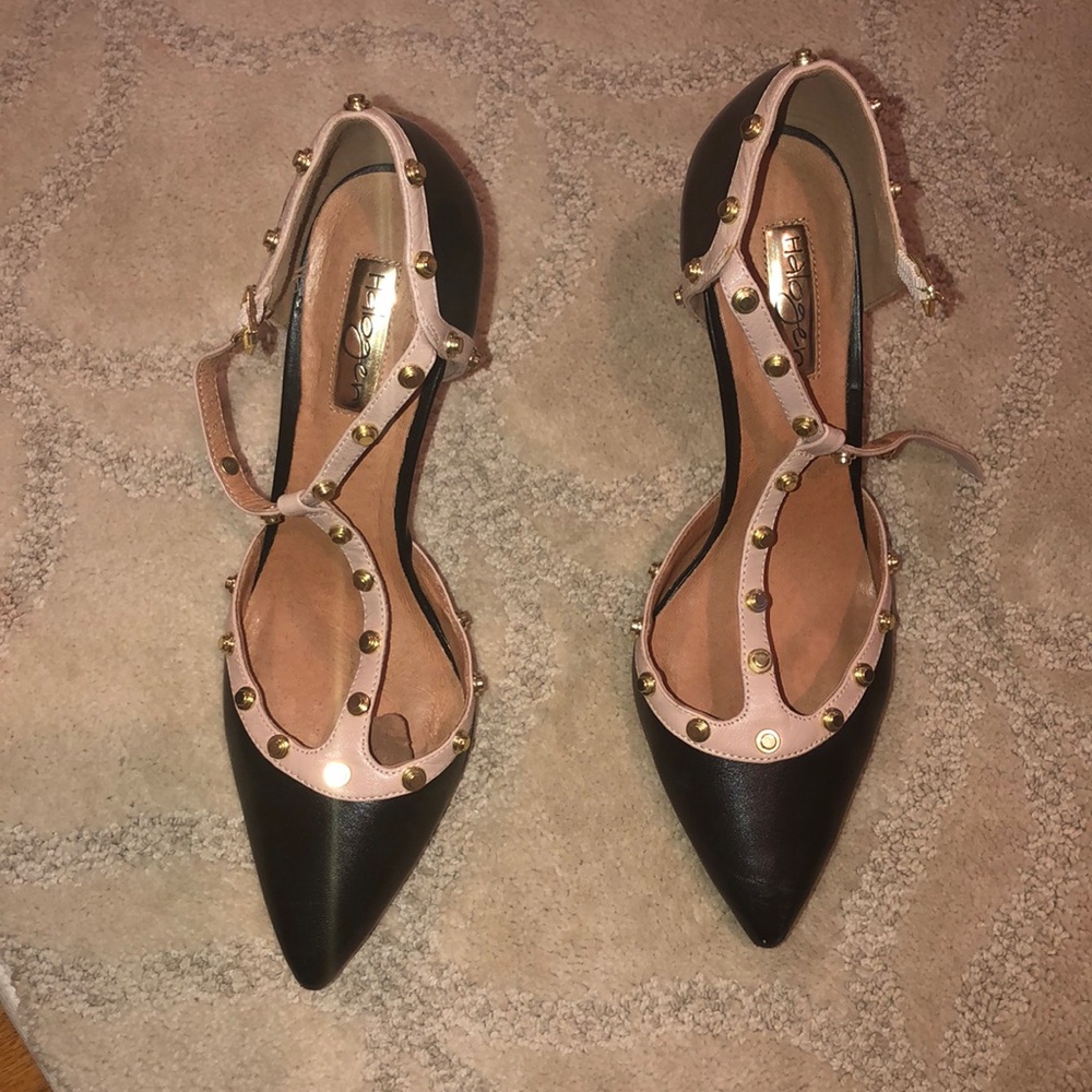 Black heels. Tan trim. Yellow gold grommets.